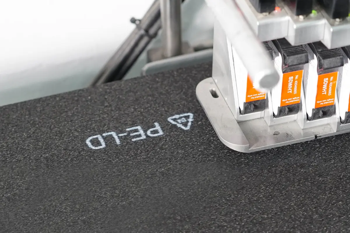 Marking a plastic symbol on foam products with inkjet printing