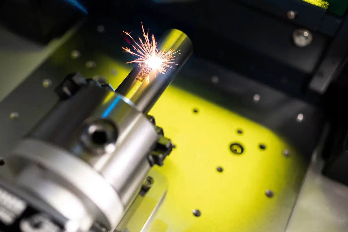 Laser marking system integrated into a machine