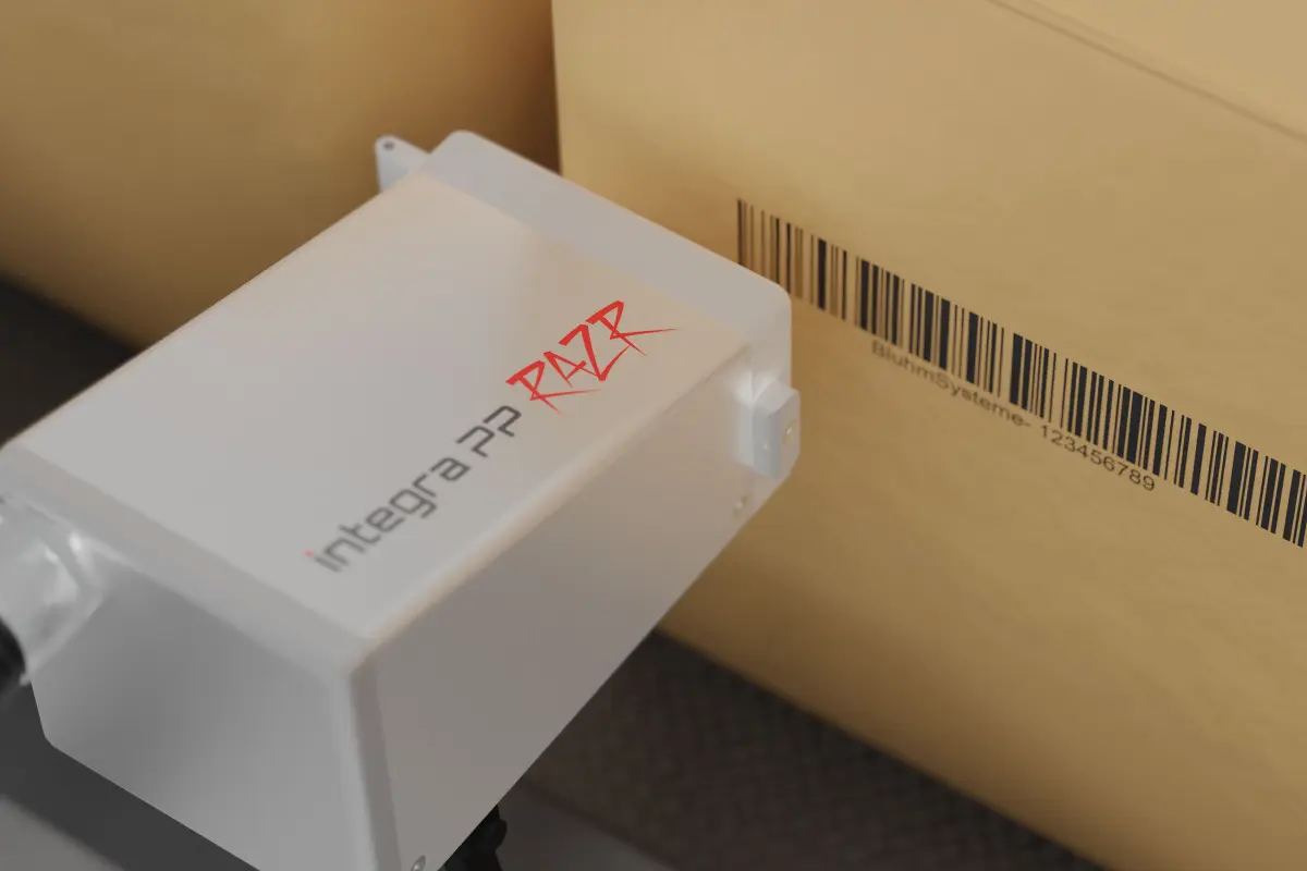 Inkjet printer coding a barcode on a cardboard box