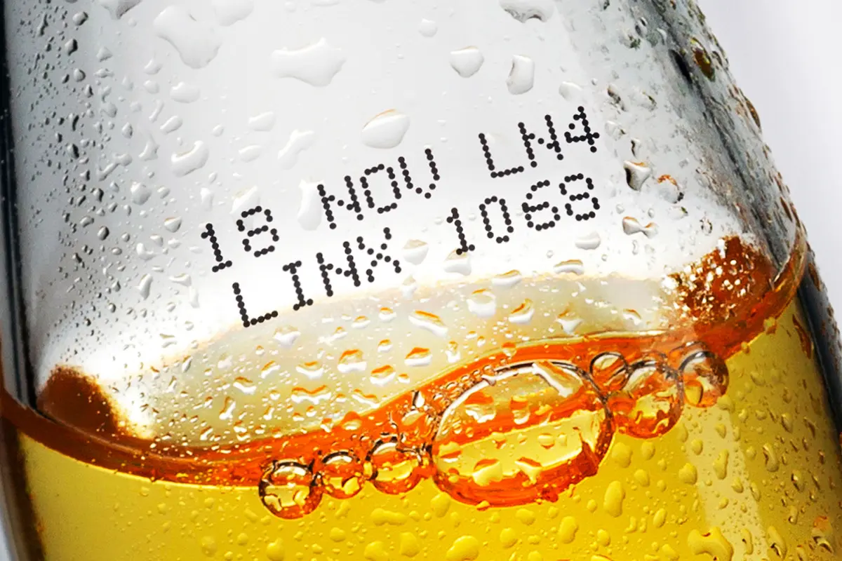 Black inkjet marking on glass bottle