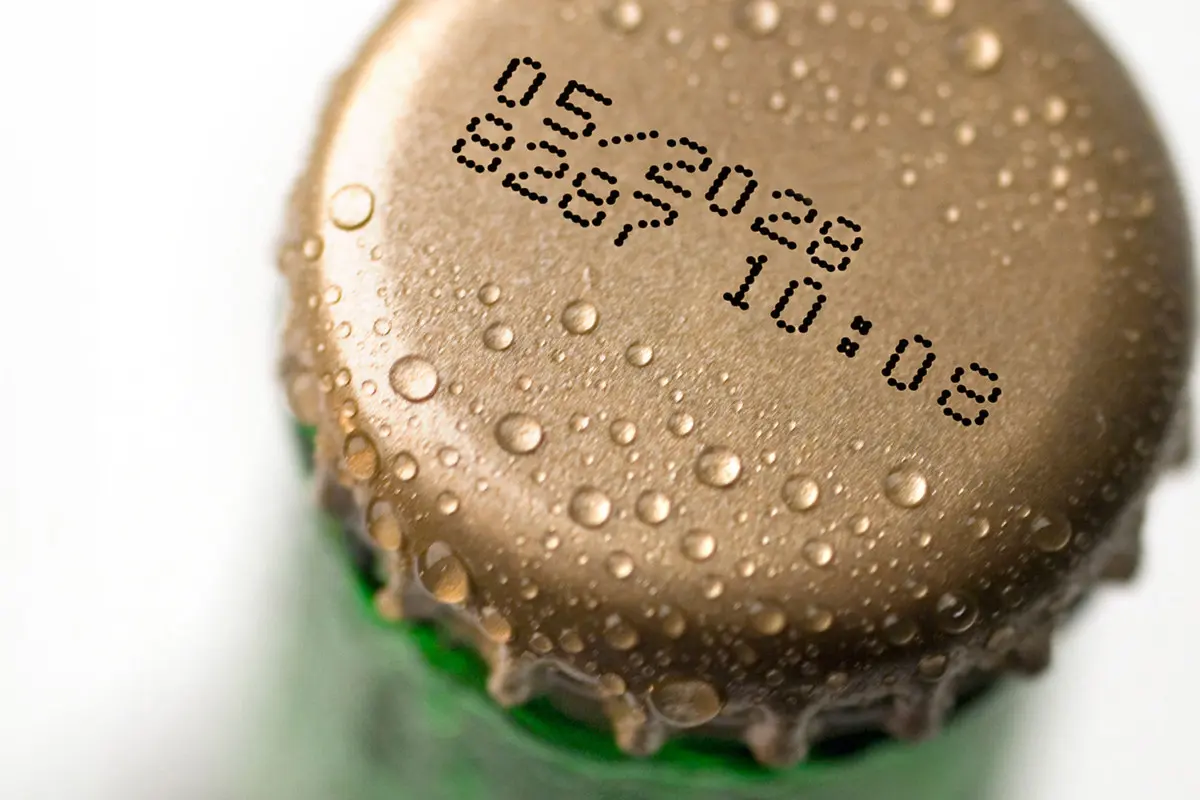 Bottle caps made of metal marked with black ink